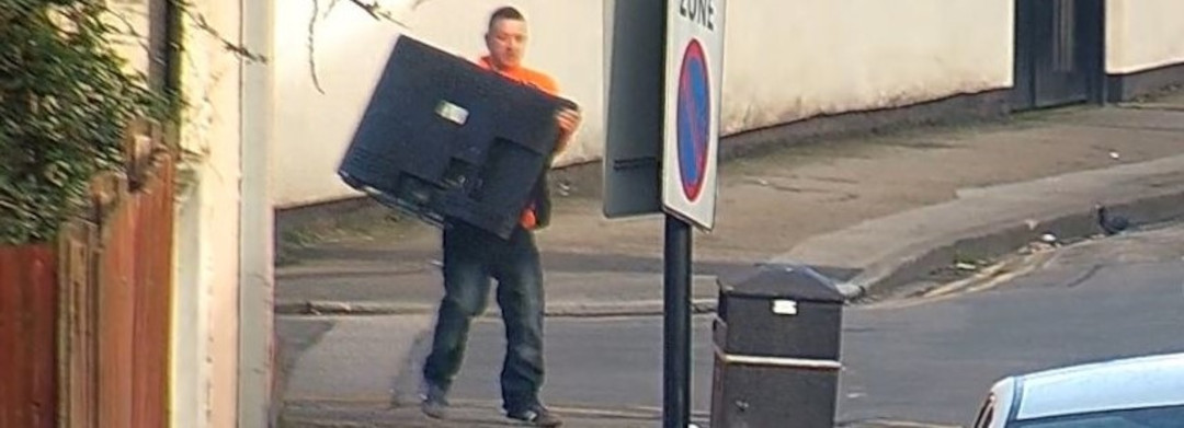 An image showing a person flytipping