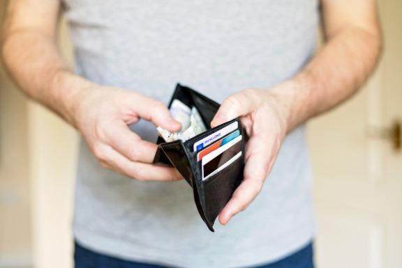 Person holding wallet